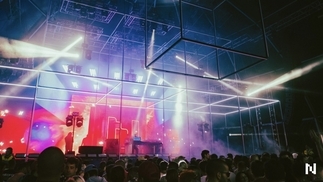 Photo of a pink, purple and blue-lit stage at Neopop festival