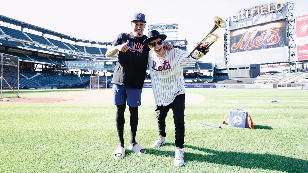 Photo of Timmy Trumpet and NY Mets player Edwin Diaz posing on the diamond
