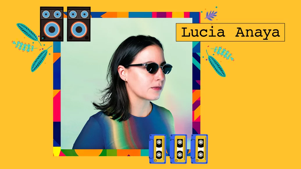 Photo of Lucia Anaya wearing a blue jumper and black glasses on a light yellow background