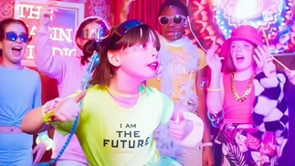 Photo of a few children dancing in the music video for 'The Spark'