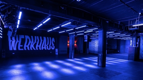Photo taken inside an empty Werkhaus club with blue lighting