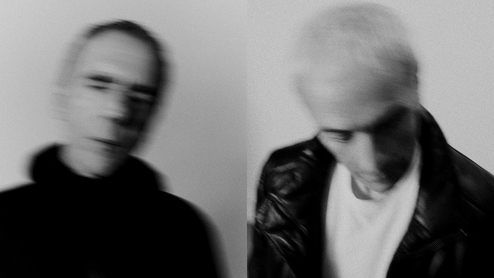 Underworld pose in a blurry black-and-white press image