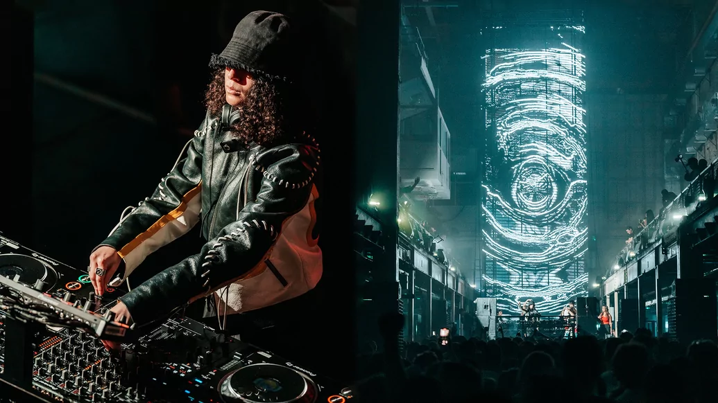 Photo of Carlita DJing at London’s Printworks while wearing a leather jacket and hat 