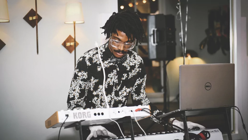 Photo of omniboi making music on a synthesiser