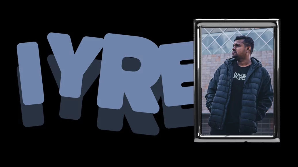 Photo of IYRE in a chrome frame with his name written in blue