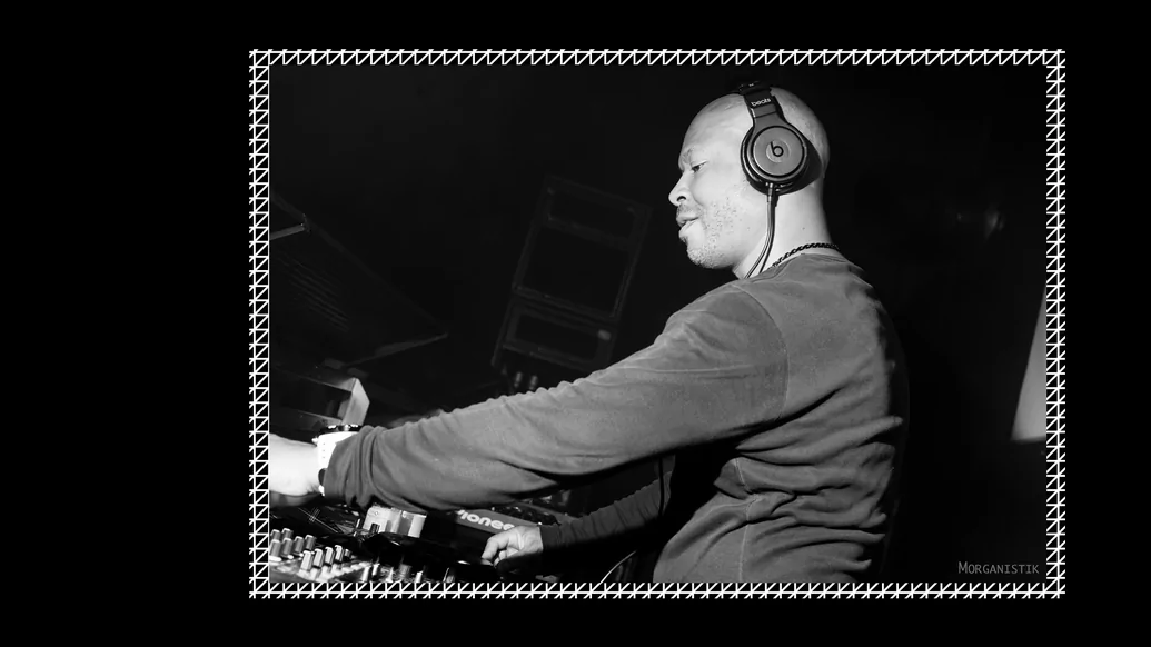 Photo of Robert Hood DJing in black and white