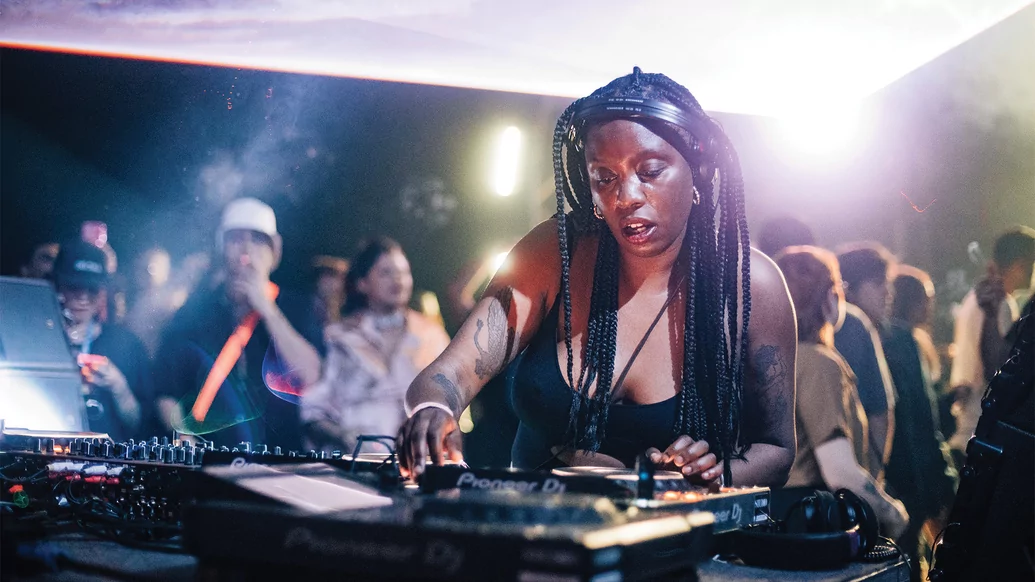 Photo of CARISTA DJing in a busy nightclub