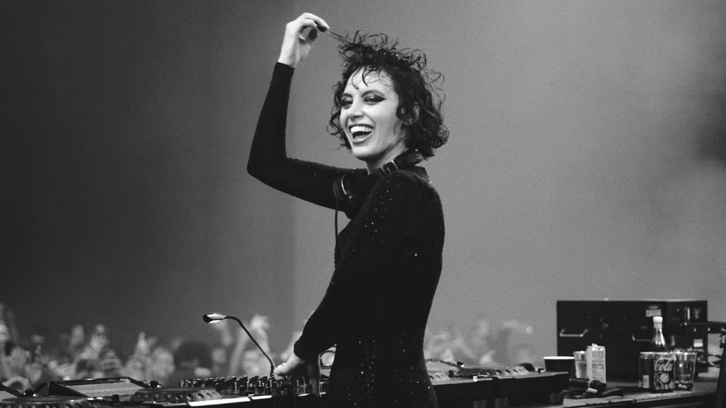 Black and white photo of Sara Landry DJing