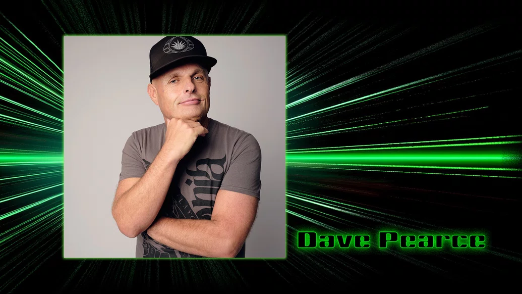 Press shot of Dave Pearce on a black background with green lasers