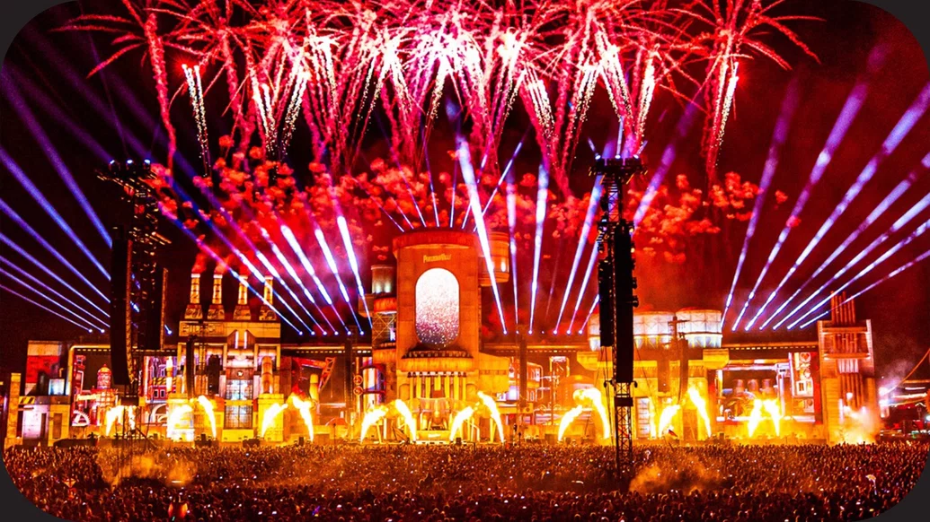 Photo of the mainstage at PAROOKAVILLE with purple lights and red fireworks