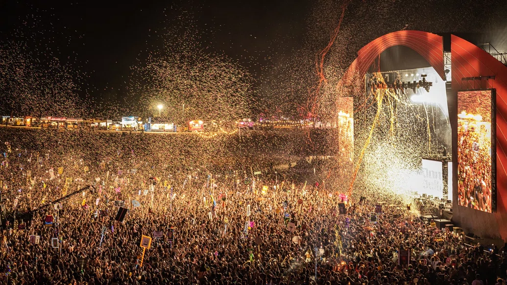 Photo of yellow ticker tape over the crowd at Beyond The Valley festival