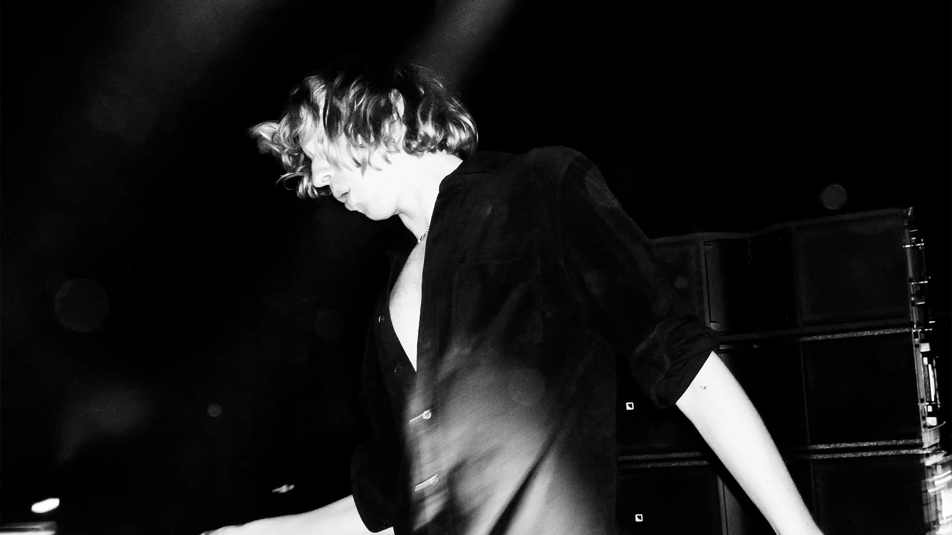 A distorted image of Daniel Avery DJing in black and white, his face obscured 
