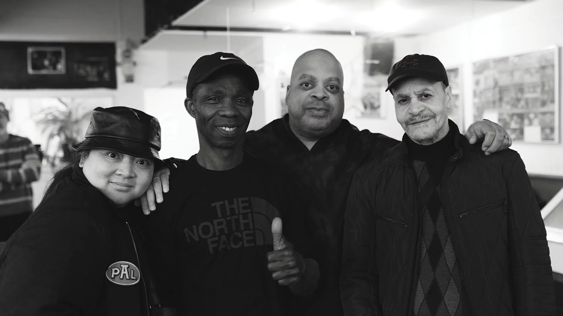 Black and white photo of Ahne, DJ Bone and two others Regenboog, Amsterdam for Homeless Homies