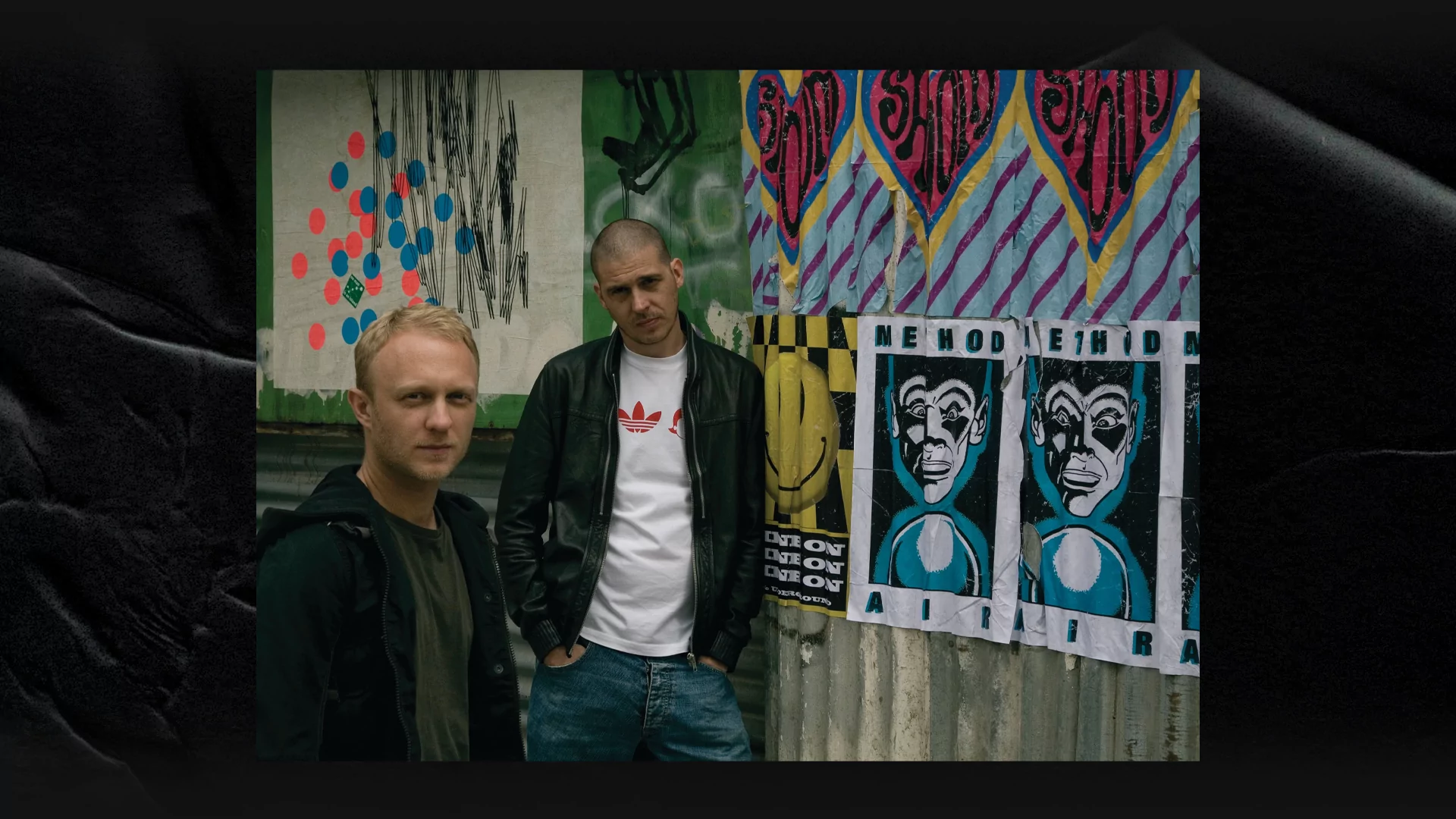  Max Reich (left) and Simon Marlin (right) of Shapeshifters pose next to graffiti and posters