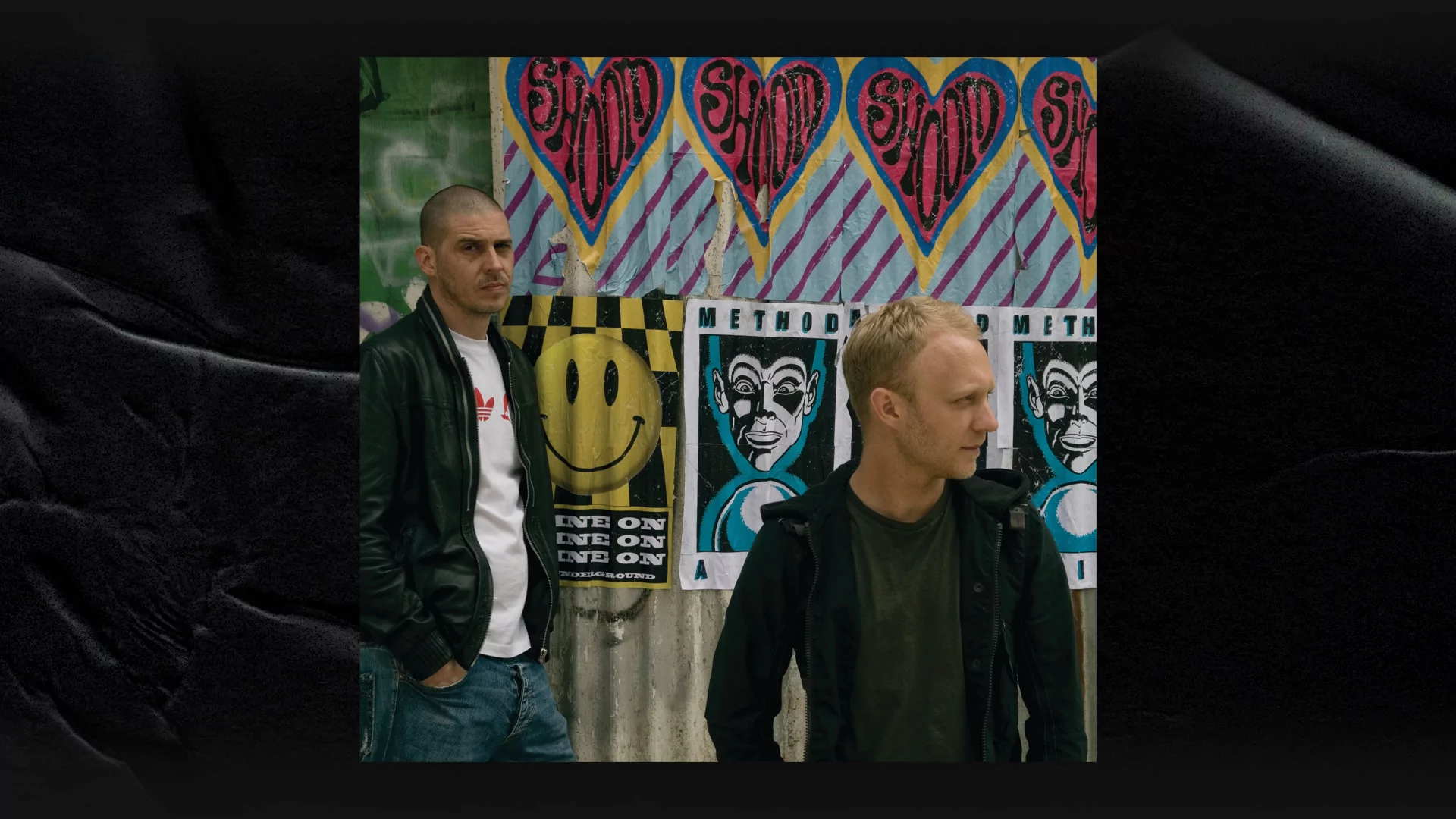  Simon Marlin (left) and Max Reich (right) of Shapeshifters pose in front of graffiti and posters
