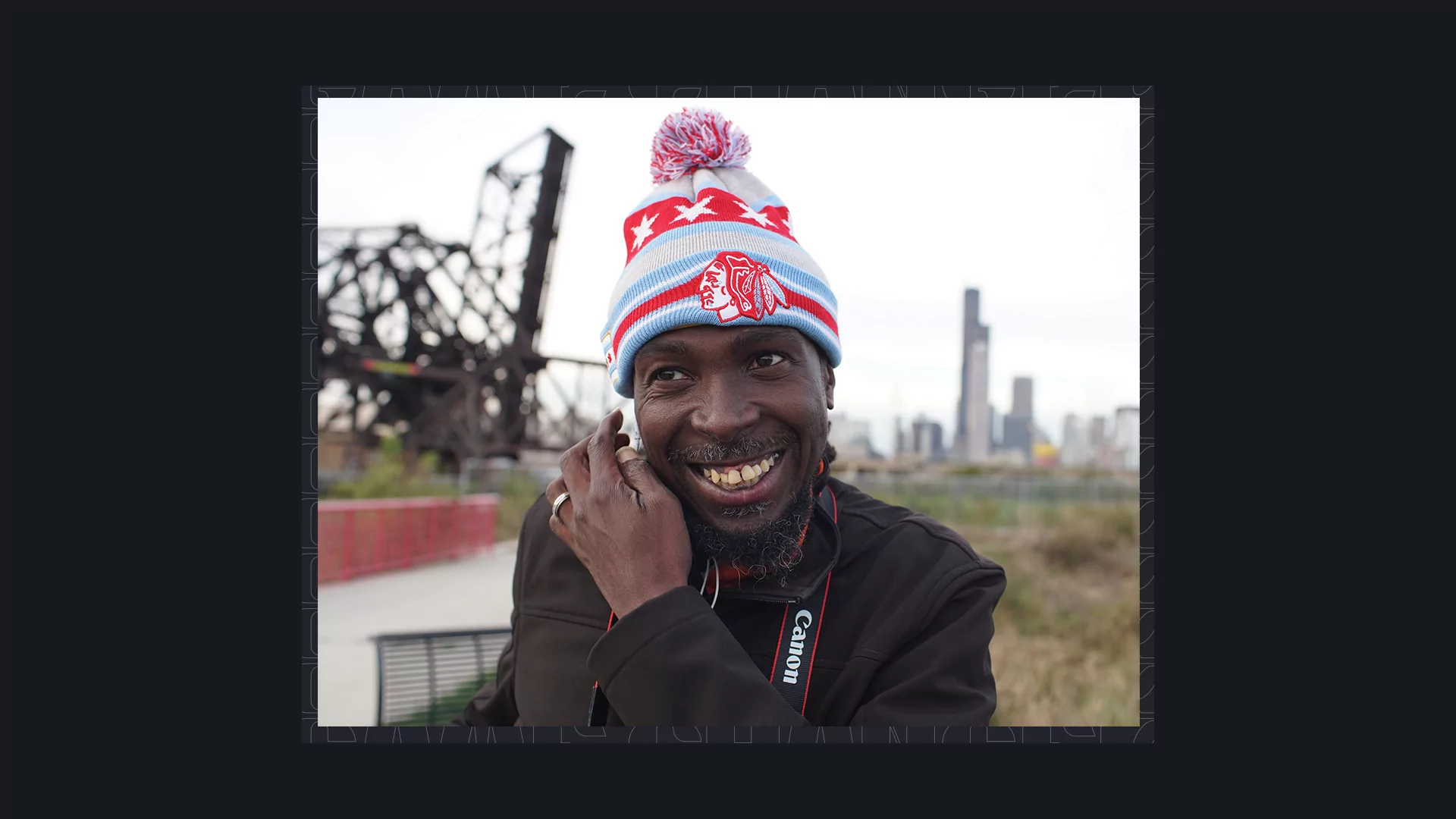 Photo of RP Boo smiling while wearing a bobble hat