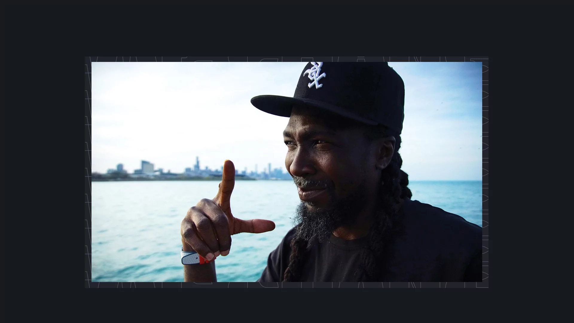 Photo of RP Boo wearing a black hat out on the water.