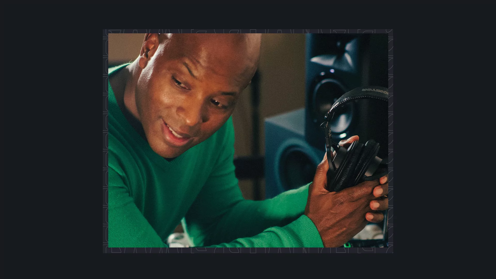 Photo of Kelly G wearing a green sweater and holding a pair of headphones with a black border.