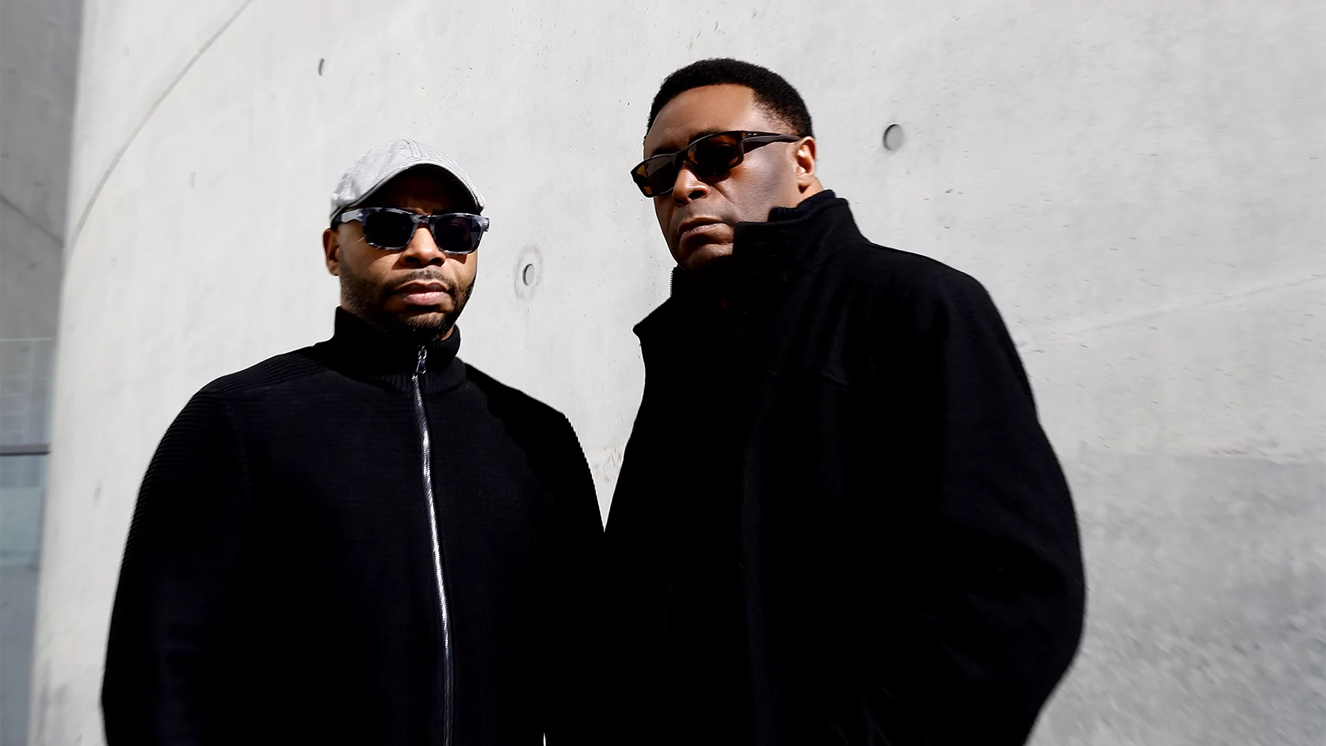Octave One stood in front of a grey wall