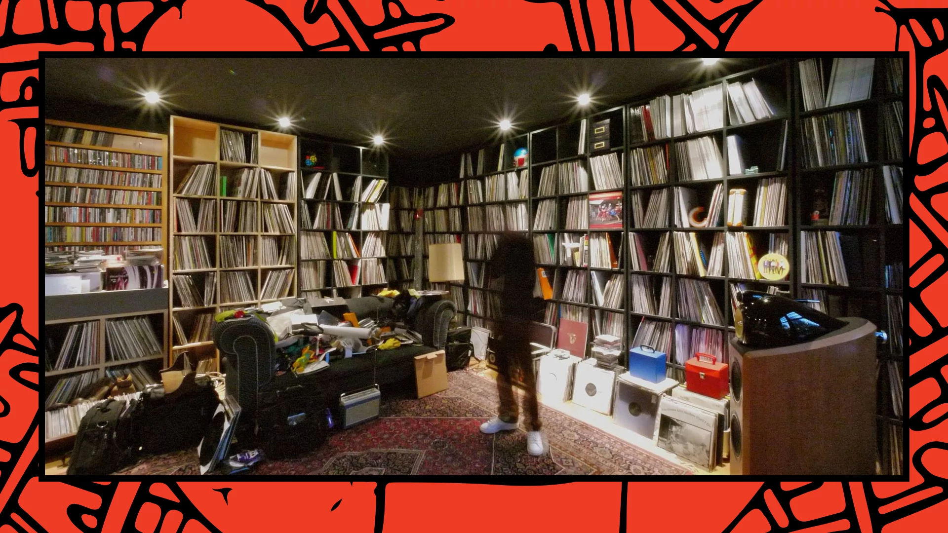 Craig Richards in his studio surrounded by walls of vinyl records
