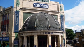 A photo of Brixton Academy in the daytime displaying Blink 182 as upcoming performers. 