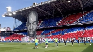A mural of Maxi Jazz hanging from the stands at Selhurst Park