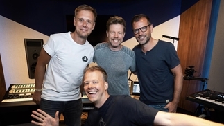 Photo of Armin van Buuren, Ferry Corsten, Rank 1 and Ruben De Ronde in the Armada Music studio making music