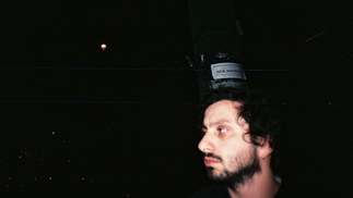Polaroid photo of Gacha Bakradze against a dark backdrop. He's looking to the right