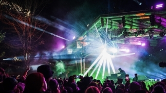 Photo of the Forest Stage at Snowbombing with blue, purple, and green lights