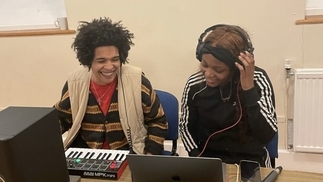 Photo of two DJs practicing behind the decks as part of Saffron’s artist development programme