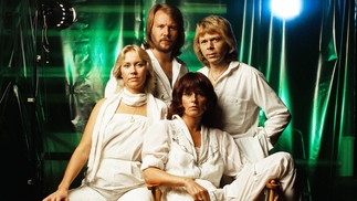Photo of the four members of ABBA wearing white outfits