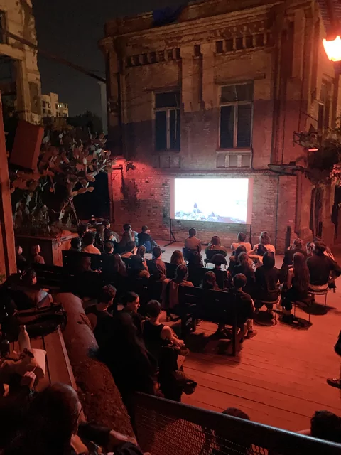 Photo of an open-air movie screening outside at Left Bank