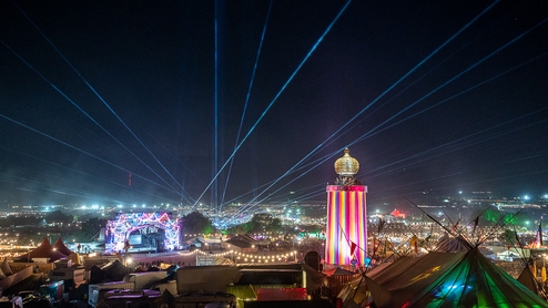 View of the Glastonbury site with lasers over the dance village