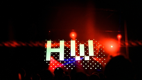 HOpe works logo projected over the dark dancefloor