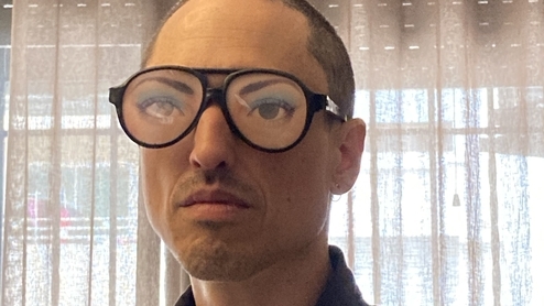Photo of G. ZIFCAK wearing glasses with eyes on them