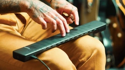 The Artiphon Chorda being played by someone placed on their lap