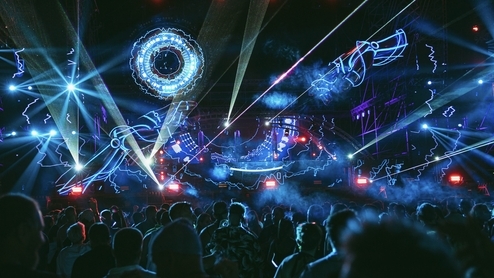 Photo of the mainstage at Beonix festival with blue and purple robotic graphics