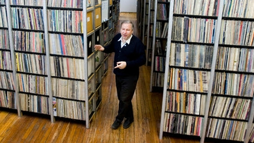 ARC founder and director B. George poses among vinyl