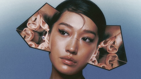 Peggy Gou 'I Hear You album cover featuring the artist wearing a "ring of ears"