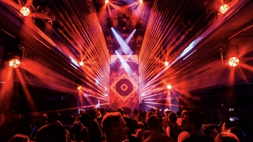 Photo of a red-lit stage at BEONIX Festival 2023