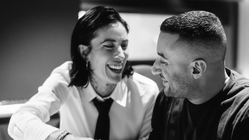 Black and white photo of Indira Paganotto & Joseph Capriati laughing together