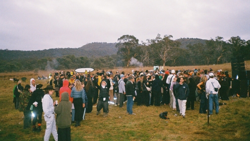 Analog photo of a small rave in a field