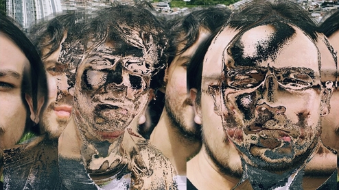 Warped photo of SVNDS with their faces manipulated