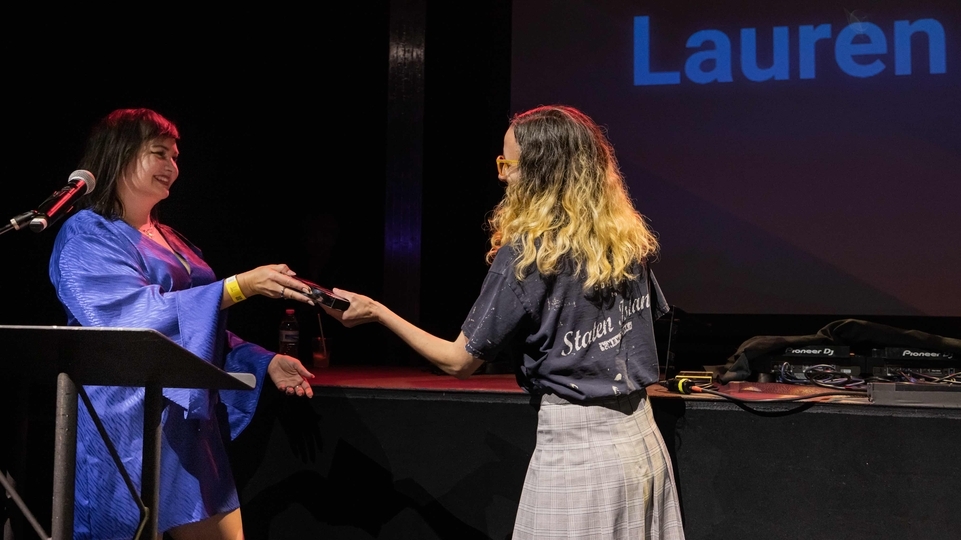 Lauren Flax receiving her award at Best of North America 2022