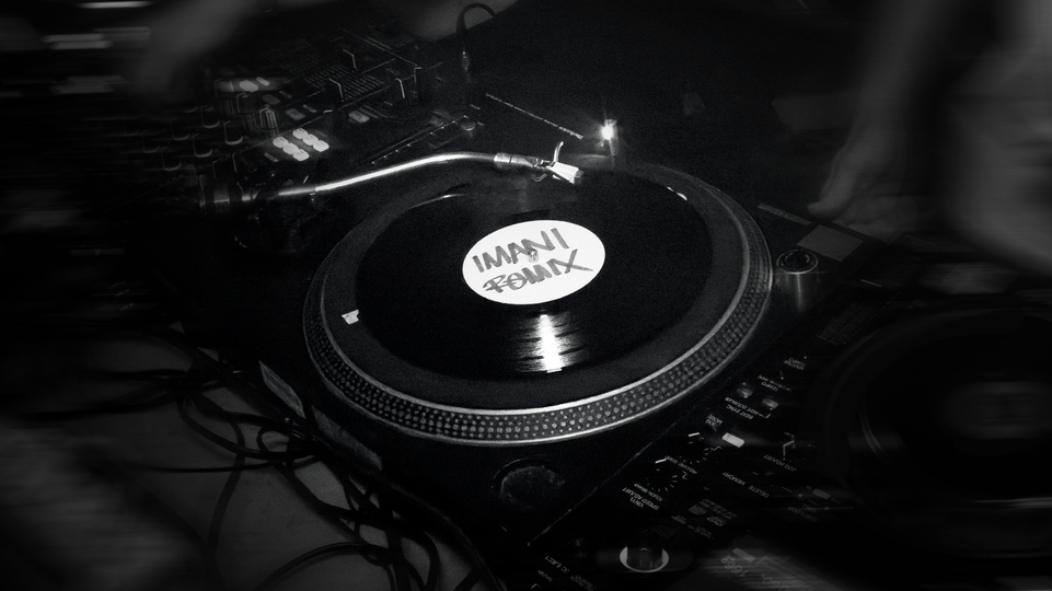 Black-and-white close-up of dubplate reading Imani Remix