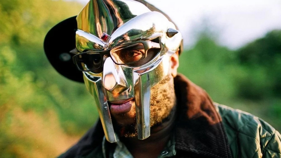 MF DOOM poses in his face mask