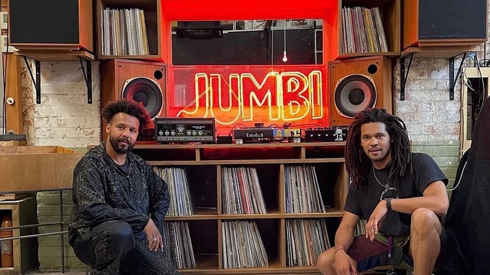 Jumbi owners Nathanael Williams and Bradley Zero pose next to the venue's sign