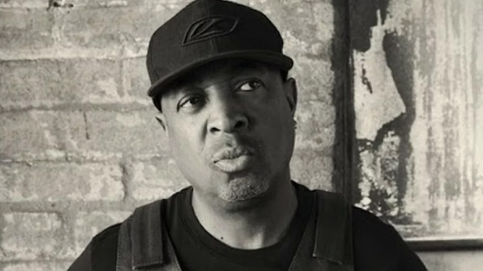 Close-up black-and-white image of rapper Chuck D
