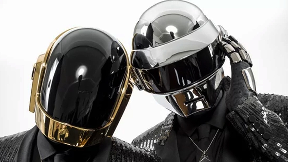 Daft Punk pose in their robot helmets