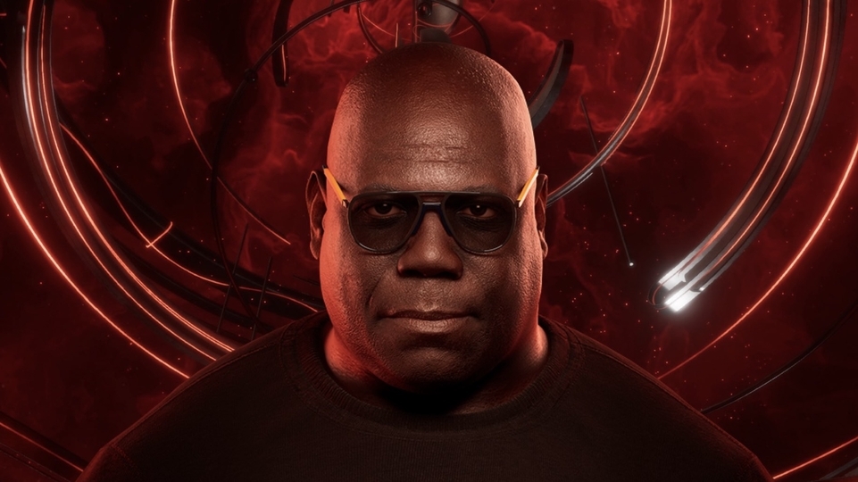 Carl Cox wearing glasses against a red futuristic background